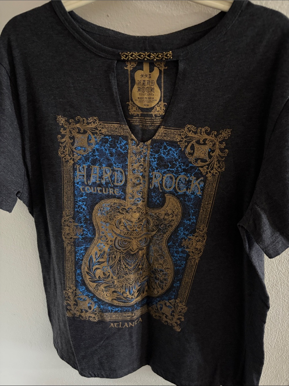 Hard Rock Cafe Black Graphic Tee with Gold and Blue Guitar Design